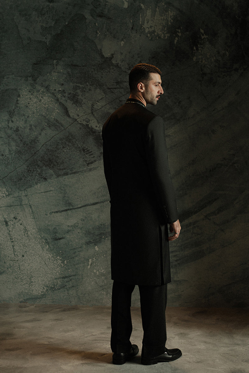 Black sherwani with intricate silver embellishments for weddings